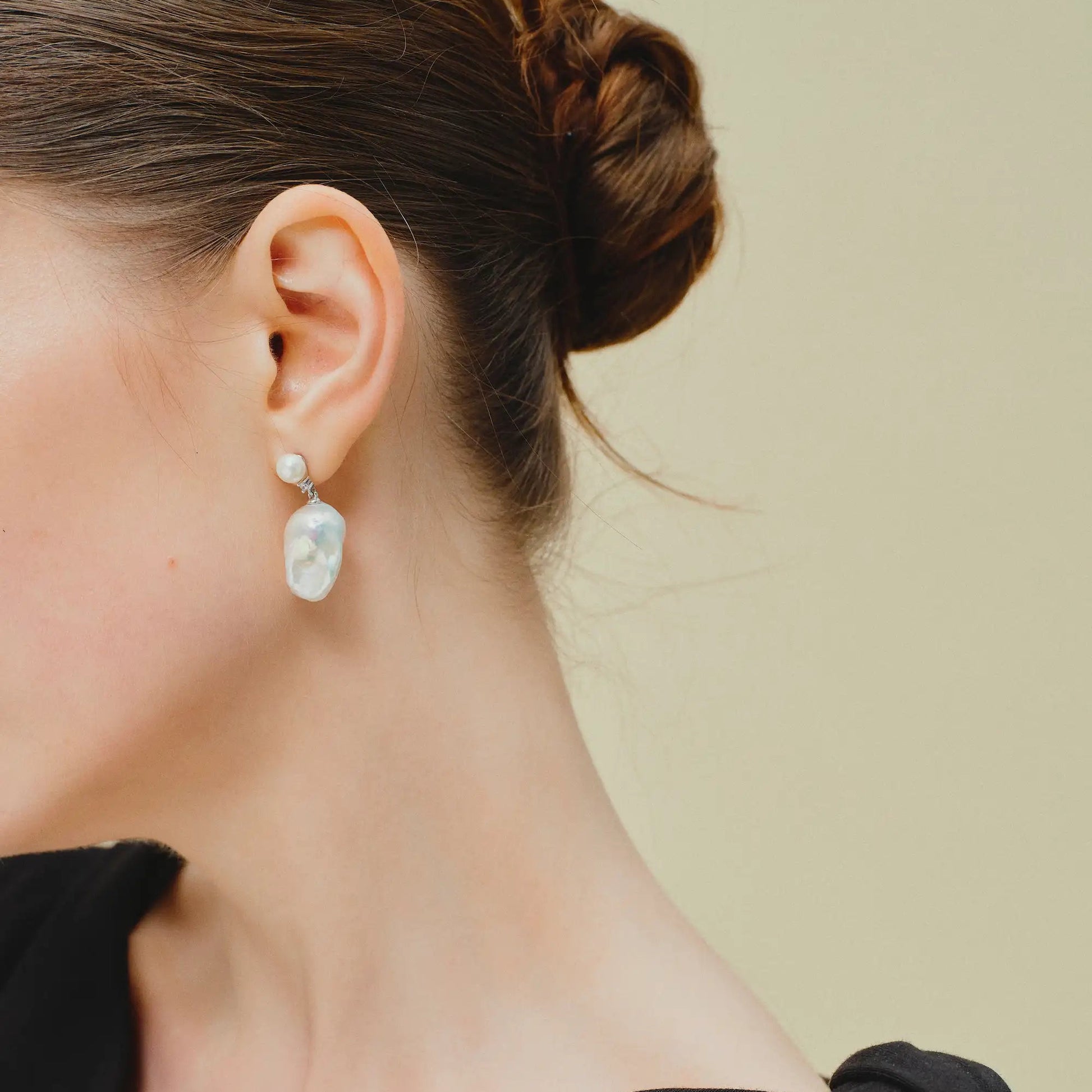 Sterling silver big baroque dual pearl drop earring on model