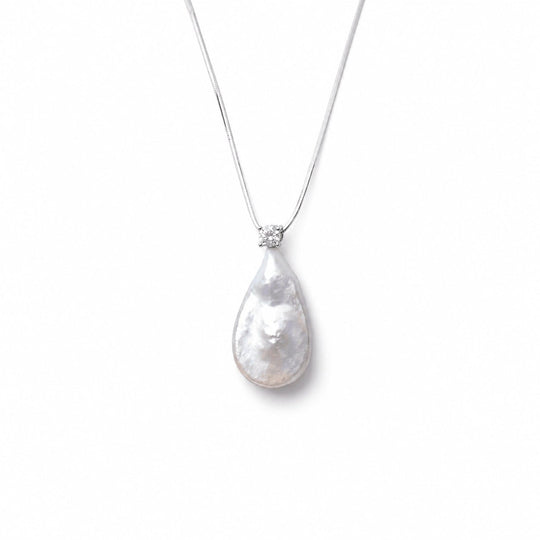 Clean white studio shot of teardrop baroque pearl silver pendant necklace, luminous organic drop white freshwater pearl with sparkling cubic zirconia top on thin polished 925 sterling silver snake chain